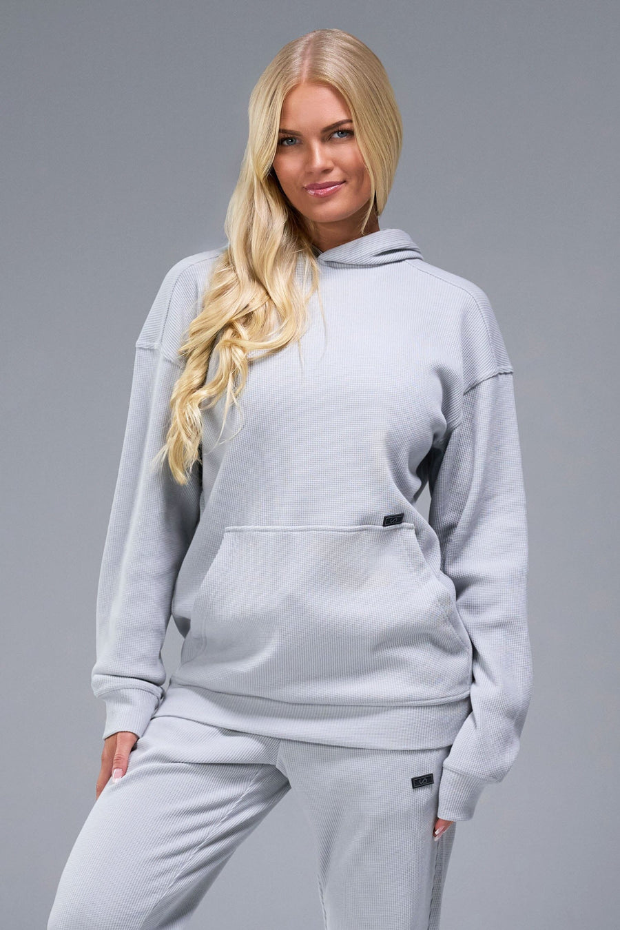 Front View of Gray TLF Elevate Waffle Tech Hoodie, featuring kangaroo pockets, and double panel hoodie designed for all day wear 