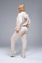 Back side View of White TLF Elevate Waffle Tech Joggers, featuring an athletic relaxed fit with zipper pockets designed for all day wear