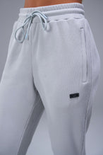 Detail Front View of Gray TLF Elevate Waffle Tech Joggers, featuring an athletic relaxed fit with zipper pockets designed for all day wear