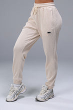 Front View of White TLF Elevate Waffle Tech Joggers, featuring an athletic relaxed fit with zipper pockets designed for all day wear