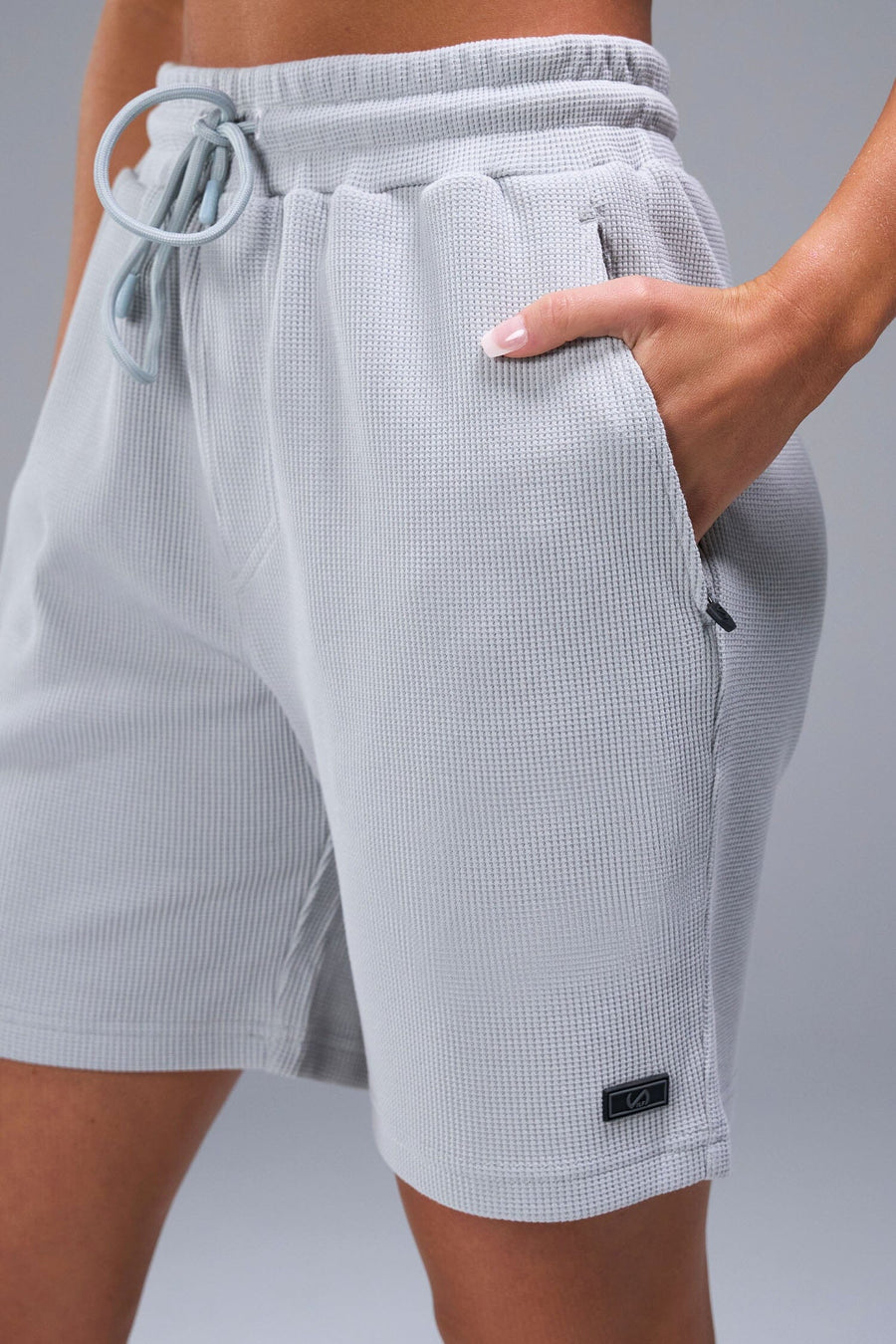 Front View of Gray TLF Elevate Waffle Tech Shorts, featuring a 6” Inch inseam, an athletic relaxed fit with zipper pockets designed for all day wear
