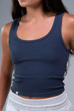 Front View of Blue TLF Essential Ribbed Tank Top, featuring a scoop neckline in our ribbed tech fabric
