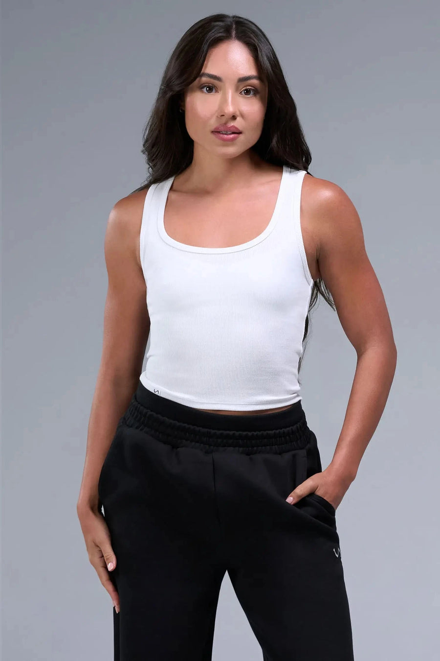 Front View of White TLF Essential Ribbed Tank Top, featuring a scoop neckline in our ribbed tech fabric 