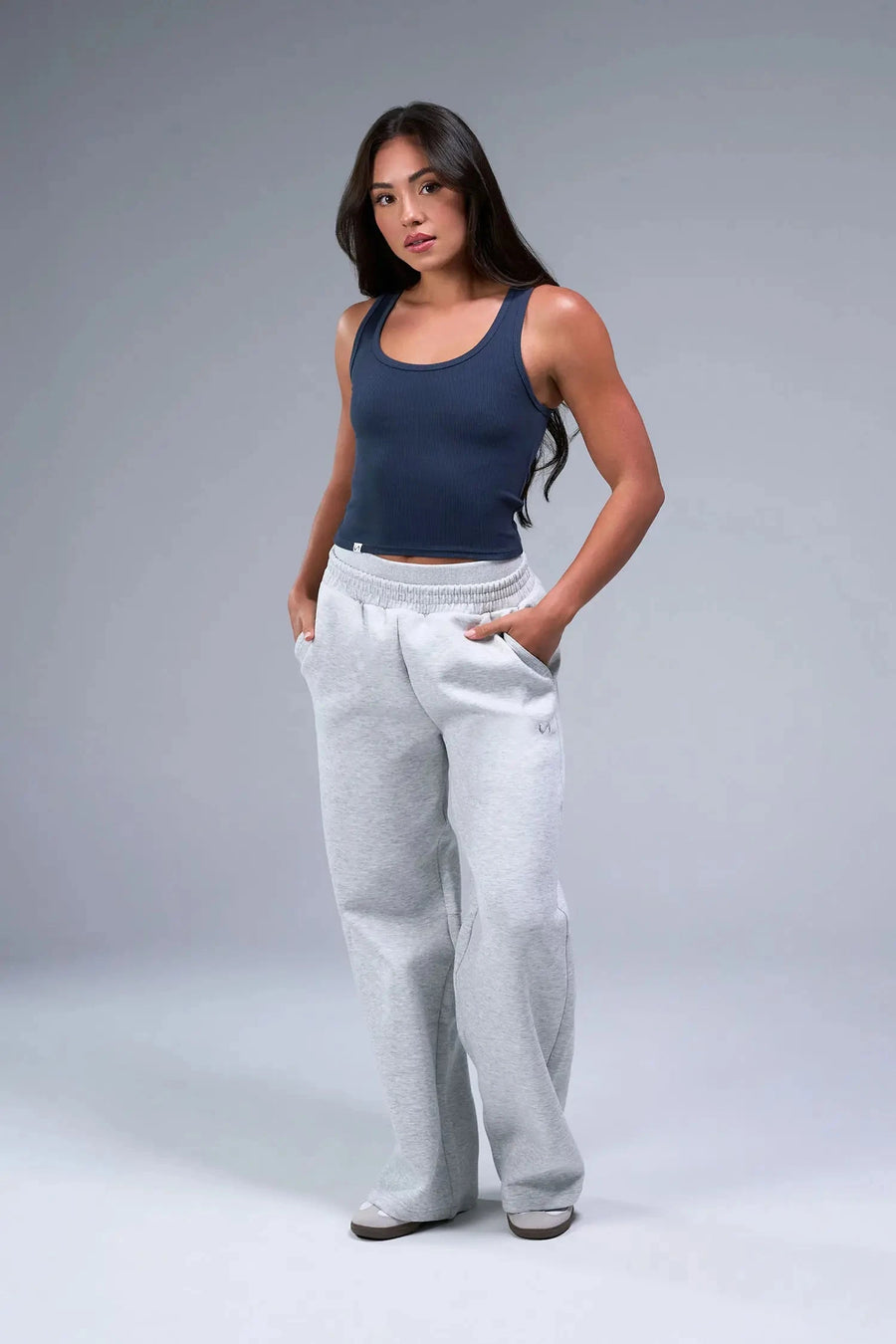 Front View of Blue TLF Essential Ribbed Tank Top, featuring a scoop neckline in our ribbed tech fabric