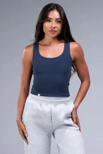 Front View of Blue TLF Essential Ribbed Tank Top, featuring a scoop neckline in our ribbed tech fabric
