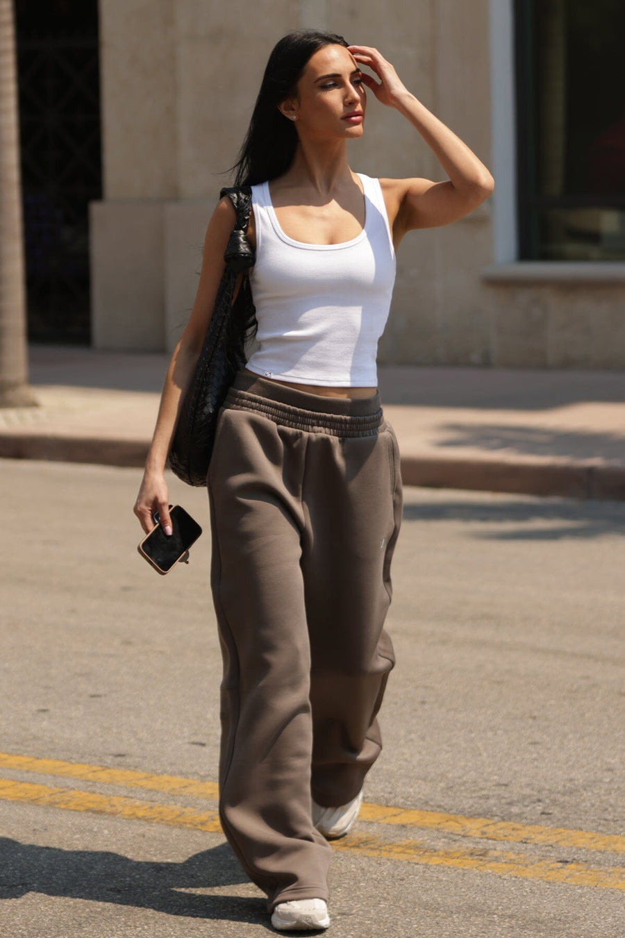 Front View of White TLF Essential Ribbed Tank Top, featuring a scoop neckline in our ribbed tech fabric 