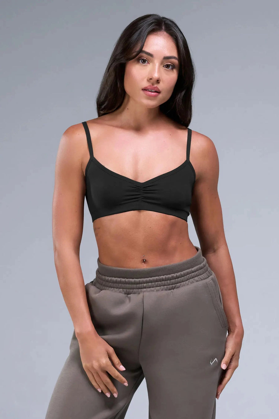 Front View of Black TLF Essential Scrunch Seamless Bralette, featuring adjustable straps for a custom fit and scrunch front design 