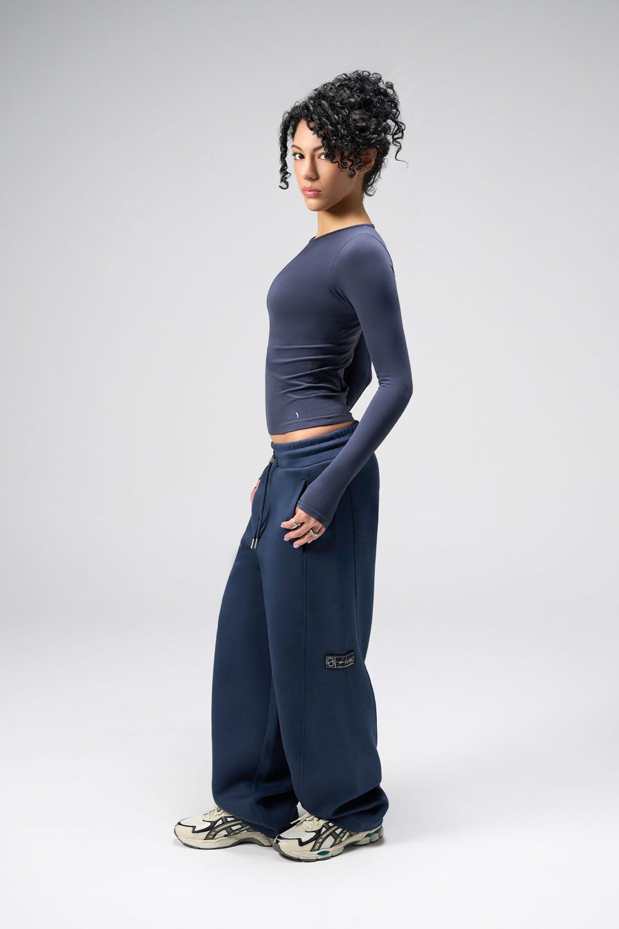 Side View Of Women's Essential Seamless Long Sleeve Top in Blue Nights