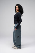 Side View Of Women's Essential Seamless Long Sleeve Top in Black