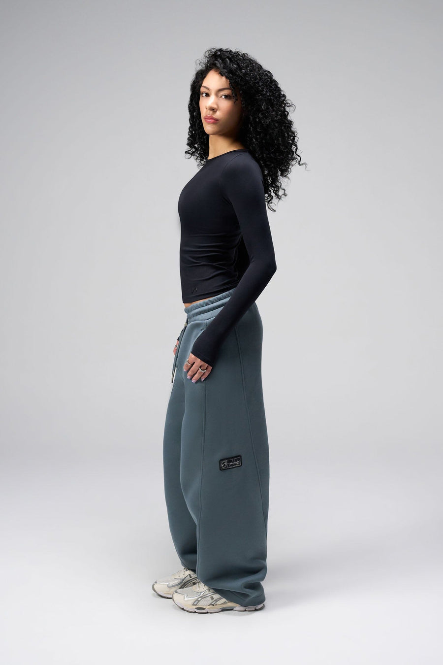 Side View Of Women's Essential Seamless Long Sleeve Top in Black