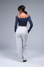 Back View of Blue TLF Essential Seamless off the shoulder top, featuring a cropped length and thumbholes 