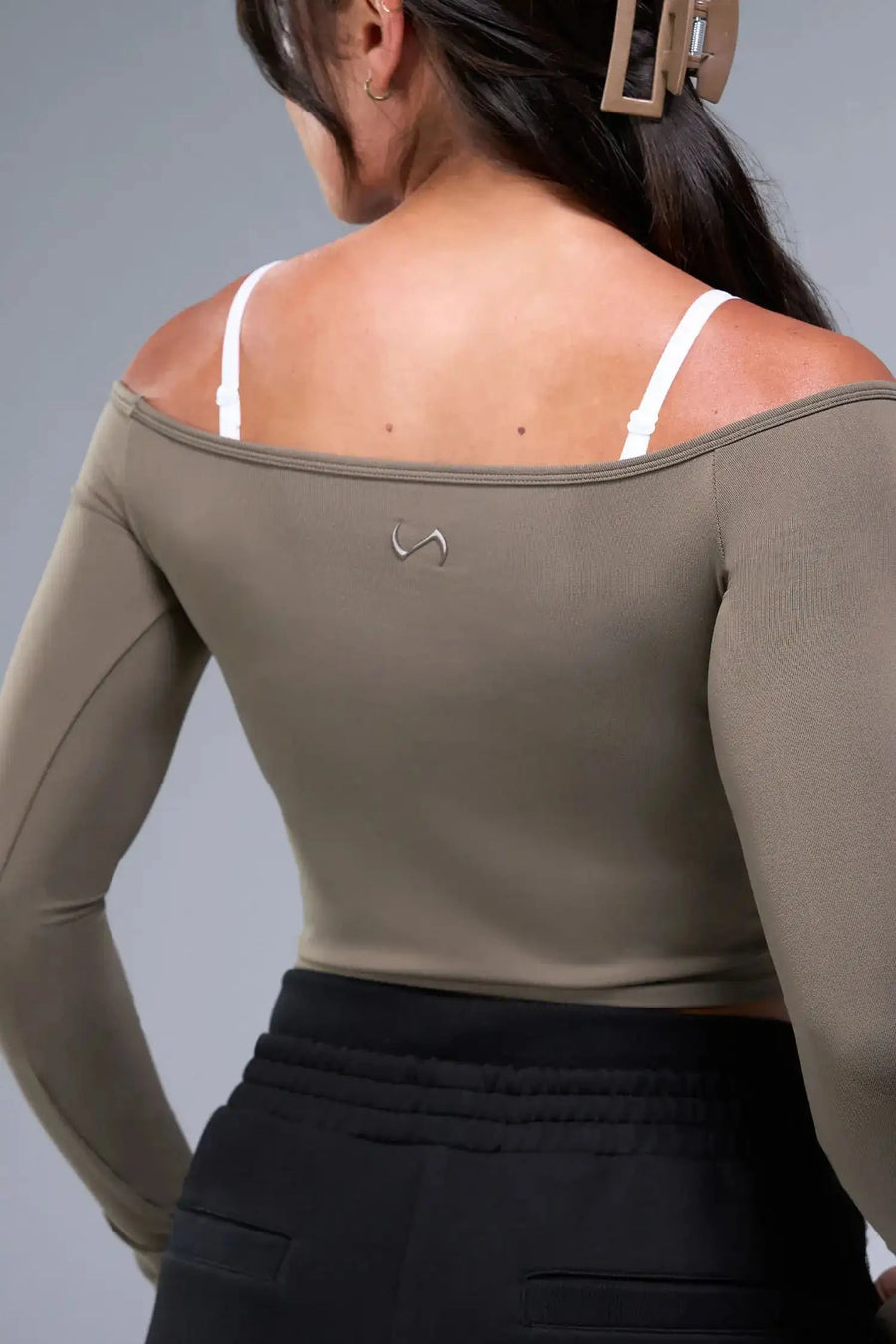 Back View of Brown TLF Essential Seamless off the shoulder top, featuring a cropped length and thumbholes 