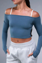 Front View of Blue TLF Essential Seamless off the shoulder top, featuring a cropped length and thumbholes 