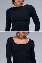 Detail Front View of Black TLF Essential Seamless Reversible Scoop Neck, featuring thumbholes and multi wear for boat neck or scoop neck styling 