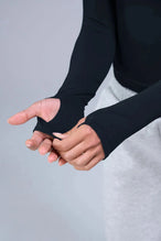 Detail Sleeves View of Black TLF Essential Seamless Reversible Scoop Neck, featuring thumbholes and multi wear for boat neck or scoop neck styling 