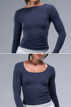 Front View of Blue TLF Essential Seamless Reversible Scoop Neck, featuring thumbholes and multi wear for boat neck or scoop neck styling 