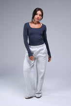 Front View of Blue TLF Essential Seamless Reversible Scoop Neck, featuring thumbholes and multi wear for boat neck or scoop neck styling 