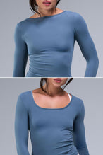 Front View of Blue TLF Essential Seamless Reversible Scoop Neck, featuring thumbholes and multi wear for boat neck or scoop neck styling 