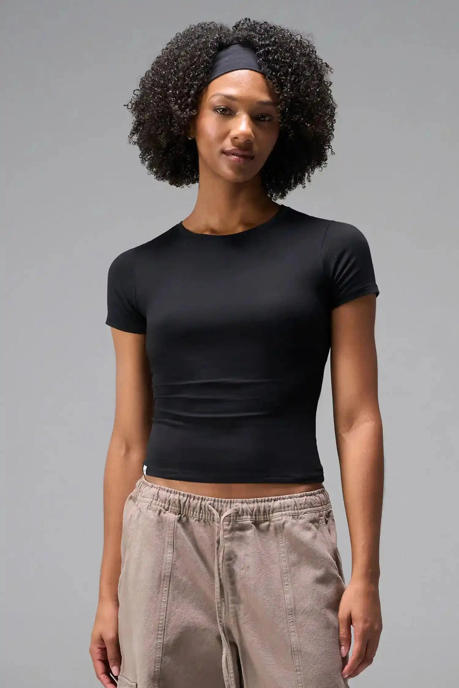 Front View of Black the TLF Fitted Crew Neck T-Shirt featuring a long line silhouette and whip stitch detailing. 