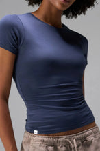 Front View of Blue the TLF Fitted Crew Neck T-Shirt featuring a long line silhouette and whip stitch detailing. 