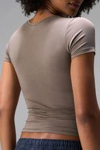 Back View of Brown the TLF Fitted Crew Neck T-Shirt featuring a long line silhouette and whip stitch detailing. 