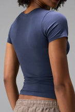 Back View of Blue the TLF Fitted Crew Neck T-Shirt featuring a long line silhouette and whip stitch detailing. 