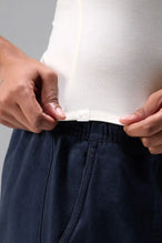 Front View of White the TLF Fitted Crew Neck T-Shirt featuring a long line silhouette and whip stitch detailing. 