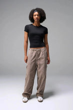 Front View of Black the TLF Fitted Crew Neck T-Shirt featuring a long line silhouette and whip stitch detailing. 