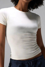 Front View of White the TLF Fitted Crew Neck T-Shirt featuring a long line silhouette and whip stitch detailing. 