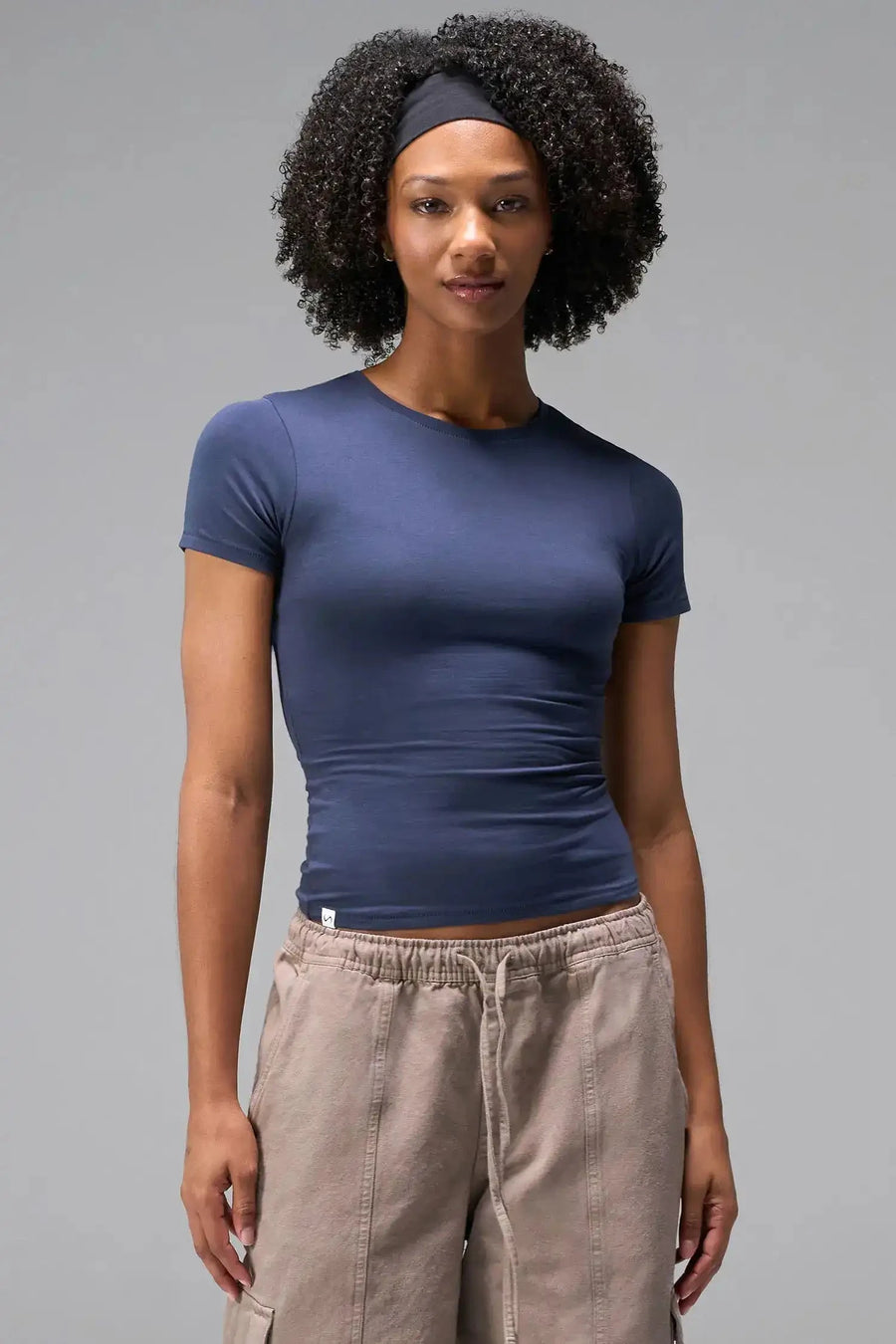 Front View of Blue the TLF Fitted Crew Neck T-Shirt featuring a long line silhouette and whip stitch detailing. 
