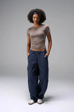 Front View of Brown the TLF Fitted Crew Neck T-Shirt featuring a long line silhouette and whip stitch detailing. 