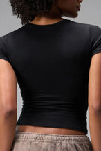 Back View of Black the TLF Fitted Crew Neck T-Shirt featuring a long line silhouette and whip stitch detailing. 