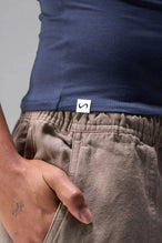 Detail Front View of Blue the TLF Fitted Crew Neck T-Shirt featuring a long line silhouette and whip stitch detailing. 