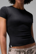Front View of Black the TLF Fitted Crew Neck T-Shirt featuring a long line silhouette and whip stitch detailing. 