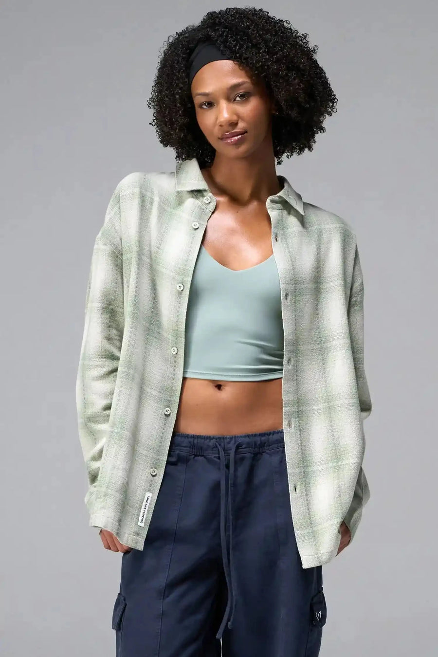 Back Detail View of the Green TLF Flannel Shacket featuring premium embroidery details on the collar and back in a cotton plaid flannel fabric