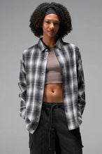 Front View of the Black TLF Flannel Shacket featuring premium embroidery details on the collar and back in a cotton plaid flannel fabric