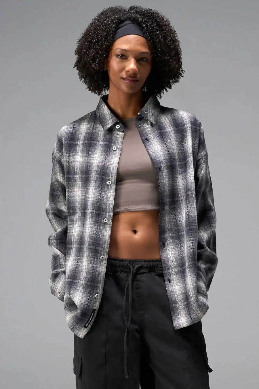 Front View of the Black TLF Flannel Shacket featuring premium embroidery details on the collar and back in a cotton plaid flannel fabric