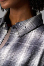 Detail Front View of the Black TLF Flannel Shacket featuring premium embroidery details on the collar and back in a cotton plaid flannel fabric