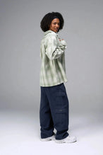 Front View of the Green TLF Flannel Shacket featuring premium embroidery details on the collar and back in a cotton plaid flannel fabric