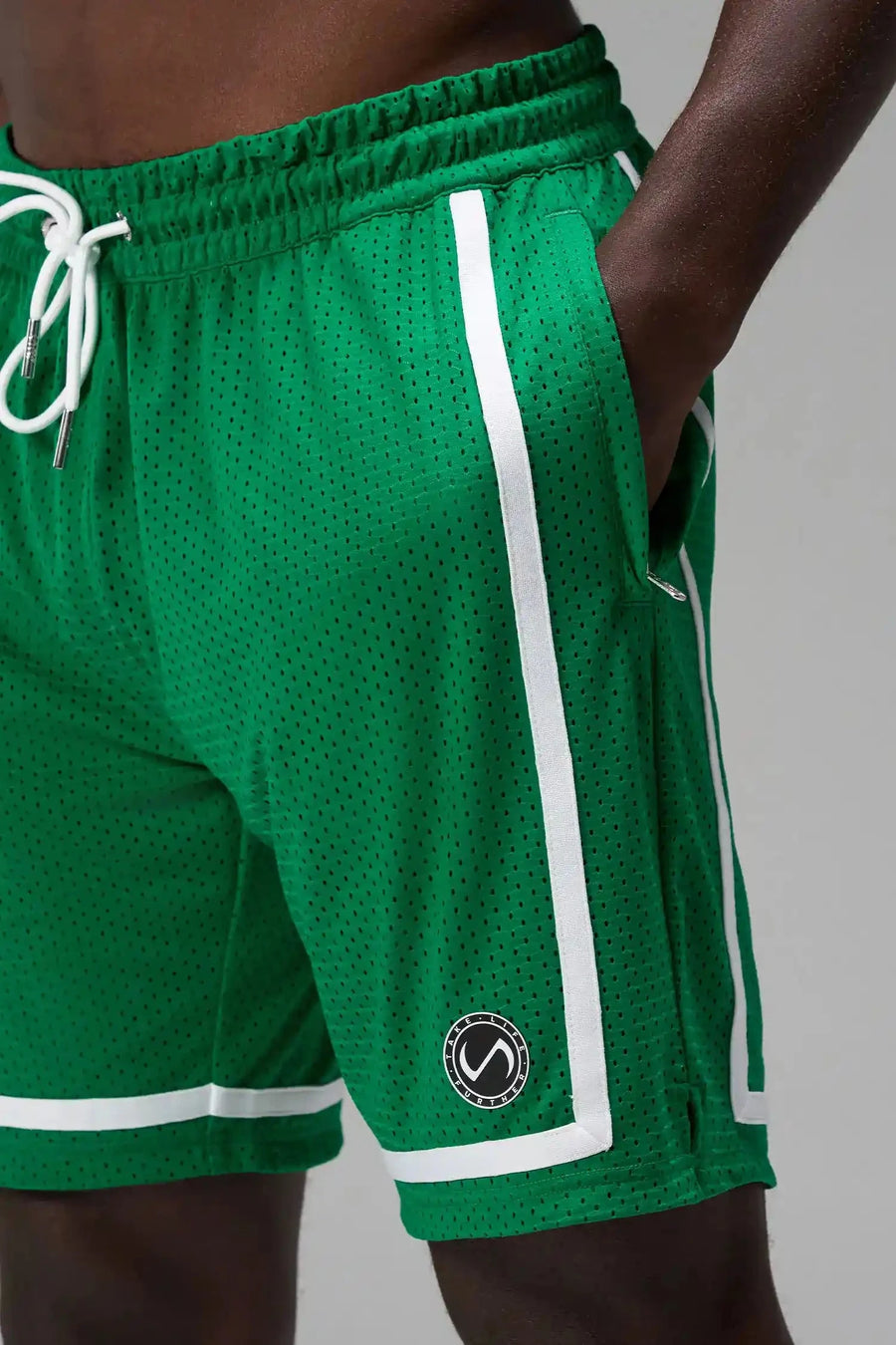 Detail Front View of Green GTS Athletic 8 Inch Shorts, featuring an 8-inch inseam and zipper pockets