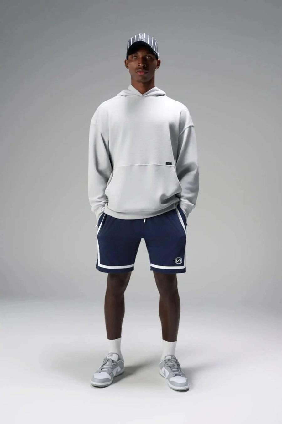 Front View of Blue GTS Athletic 8 Inch Shorts, featuring an 8-inch inseam and zipper pockets