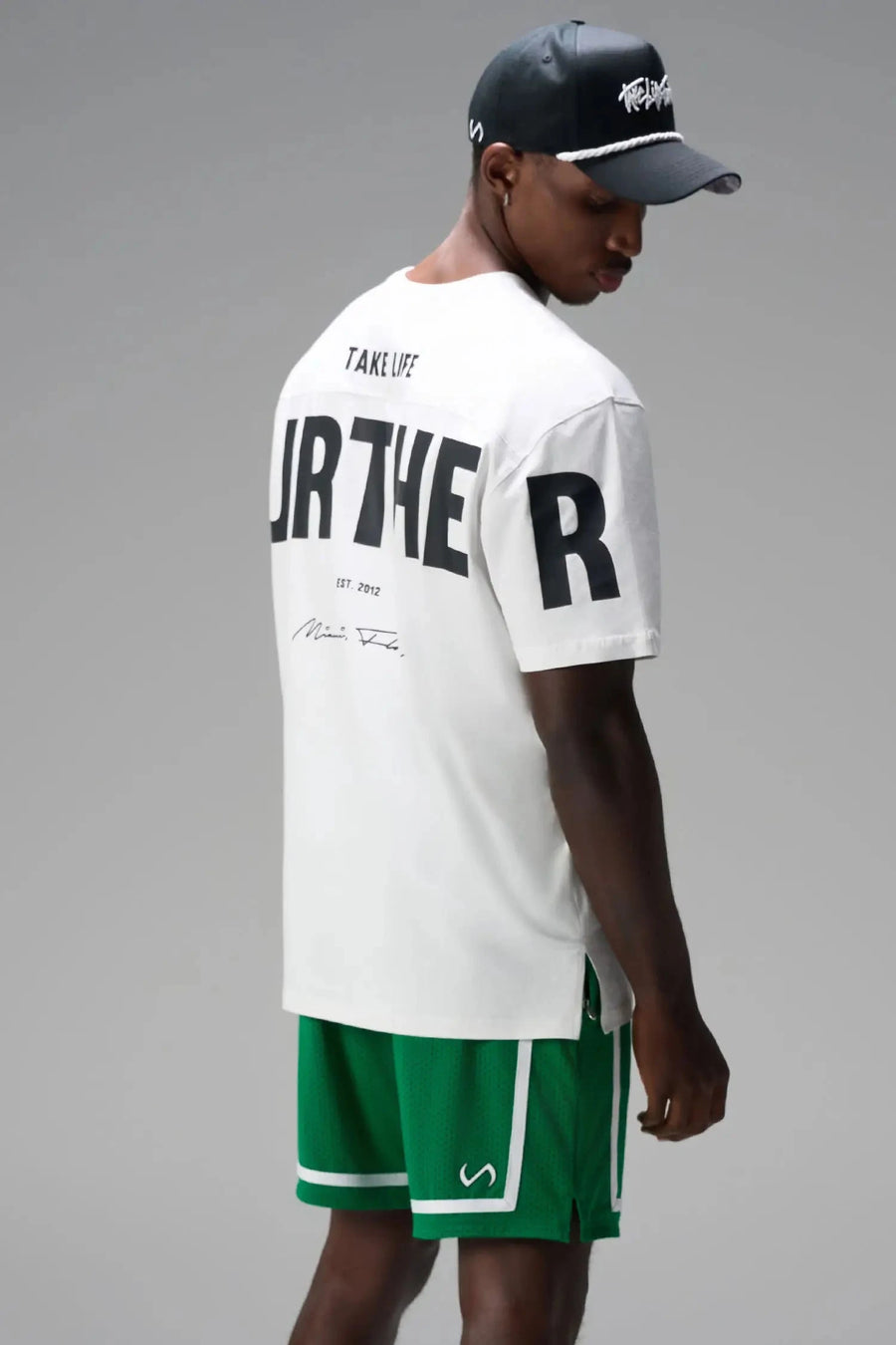 Side View of Green GTS Athletic 8 Inch Shorts, featuring an 8-inch inseam and zipper pockets