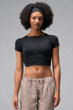 Front View of Black the TLF GTS Cropped Baby Tee features sporty raglan sleeves, cropped length and premium whip stitch detailing. 