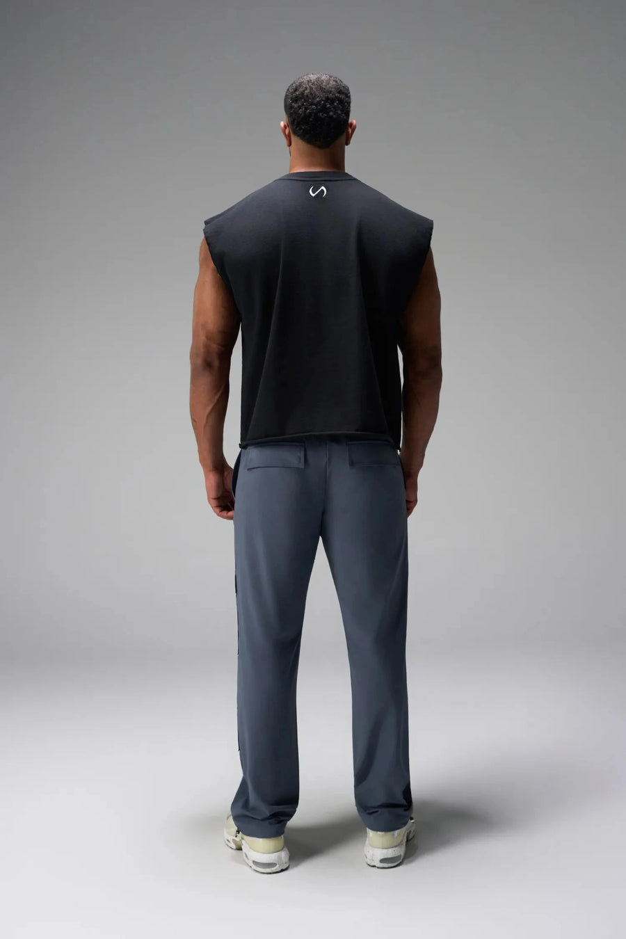 Back View of Blue the TLF GTS Element-Max Cargo Pants featuring front cargo pockets and an adjustable ankle drawcord ankle for custom fit