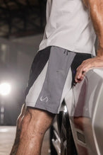 Side View of Black the TLF GTS Element-Max Shorts featuring contrast color panels and sleek invisible side zipper pockets