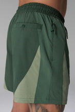 Side View of Blue the TLF GTS Element-Max Shorts featuring contrast color panels and sleek invisible side zipper pockets