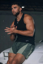 Front View of Green the TLF GTS Element-Max Shorts featuring contrast color panels and sleek invisible side zipper pockets