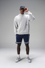 Front View of Blue GTS Athletic 8 Inch Shorts, featuring an 8-inch inseam and zipper pockets
