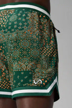 Back View of Green GTS Evolve Mesh 6 Inch Shorts, featuring university of Miami inspired patch paisley design and zipper pockets