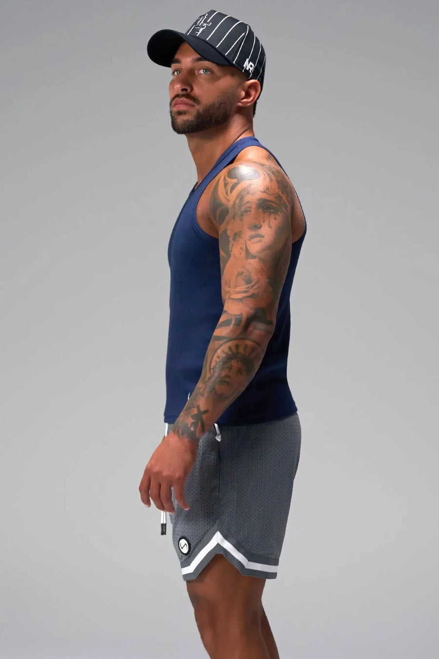 Side View of Gray GTS Evolve Mesh 6 Inch Shorts, featuring dual side pockets and 6 inch inseam for performance and functionality 